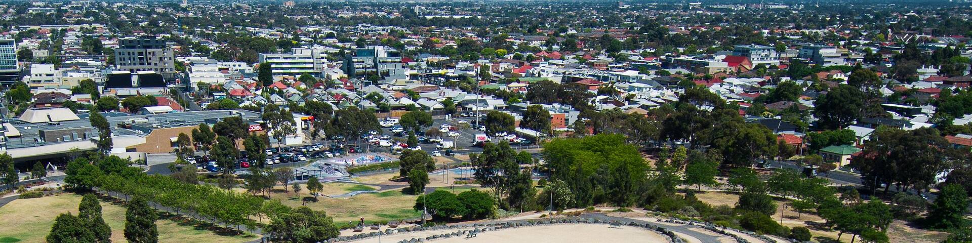 The Hilltop in the shape of a ship next to Veterans Walk and ANZAC Memorial on the site of the former Northcote Brickworks Quarry, viewed from above and the side in Melbourne, Victoria, Australia