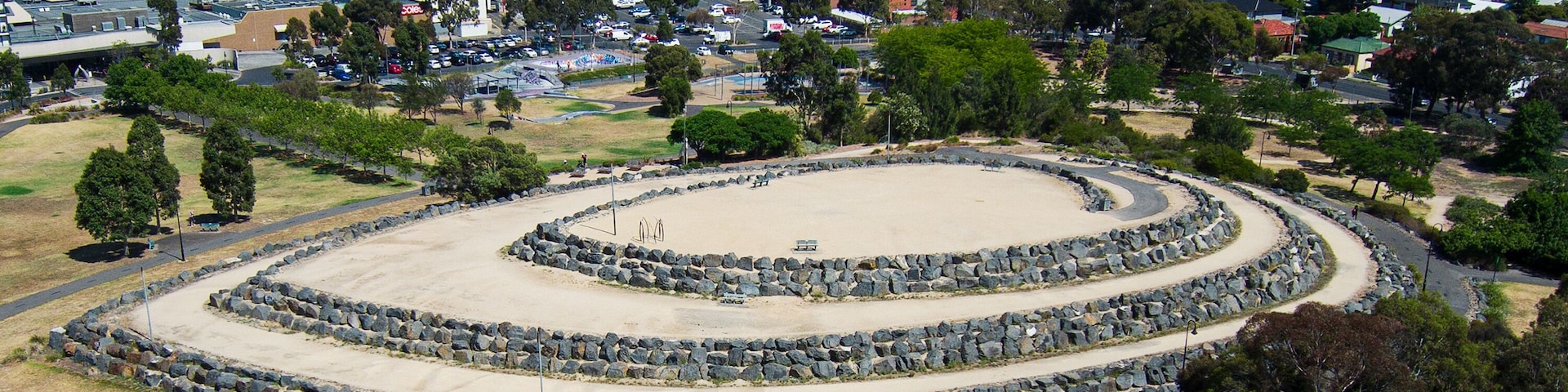 The Hilltop in the shape of a ship next to Veterans Walk and ANZAC Memorial on the site of the former Northcote Brickworks Quarry, viewed from above and the side in Melbourne, Victoria, Australia