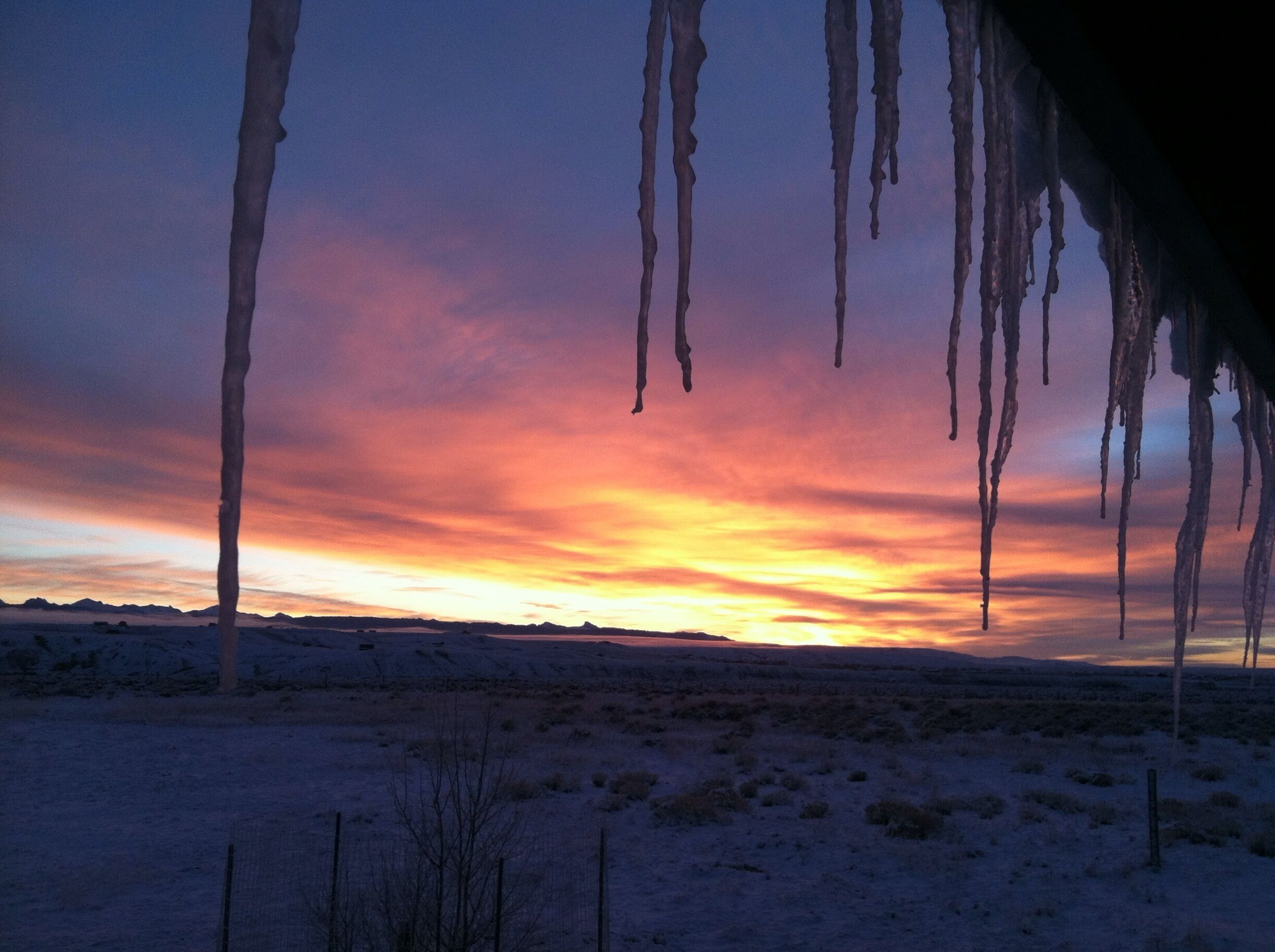 Icicles forming on my house in the early hours of a winter morning. Frigid, gorgeous Wyoming.