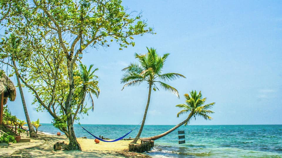 The beach at the beautiful Turtle Inn in Belize. A very popular destination for scuba diving, it's still a great place to visit even if you just want to hang out on the beach. #belize #turtleinn #beach