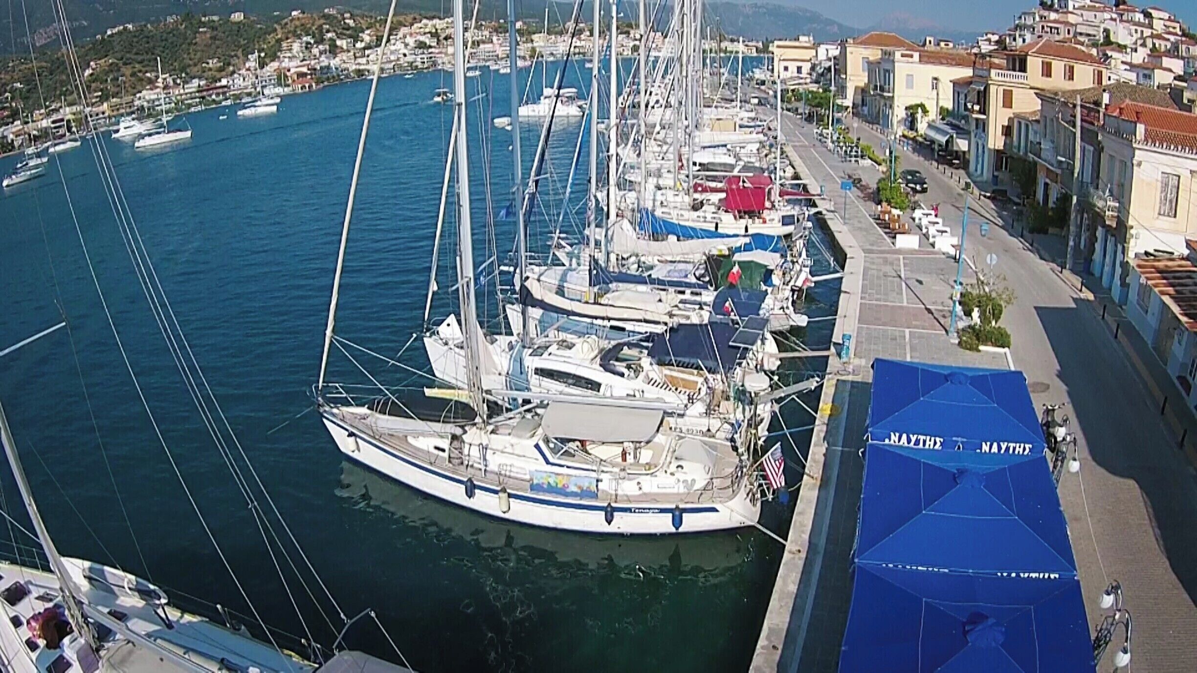 We are tied to the quay in the very wonderful town of Poros.  Great food and wine out our backdoor.

Tenaya is the first boat, with the USA flag and has been our home for 9 years.

I took this with my new toy: A quadcopter.