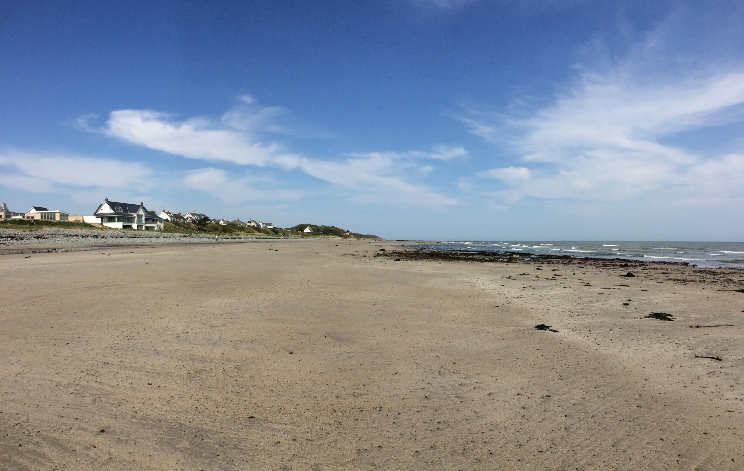 From the beach car park at Ballywalter, when the tide is out you can walk the whole way round towards Ballyhalbert.  It is worth the walk, as I find the beach nearest the caravan park almost tropical on a sunny day. 