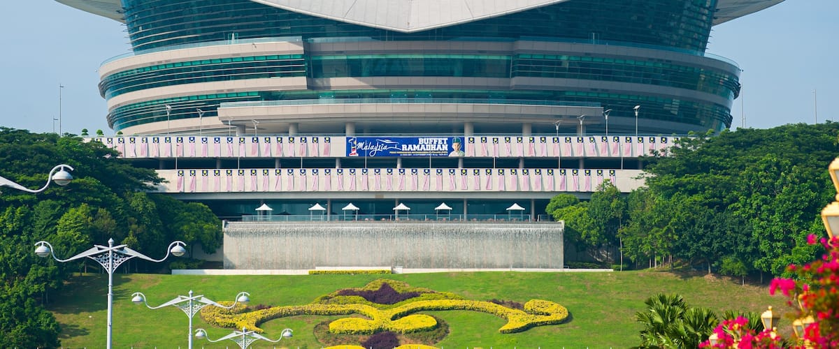 A modern building with a unique, curved design and a large central atrium.