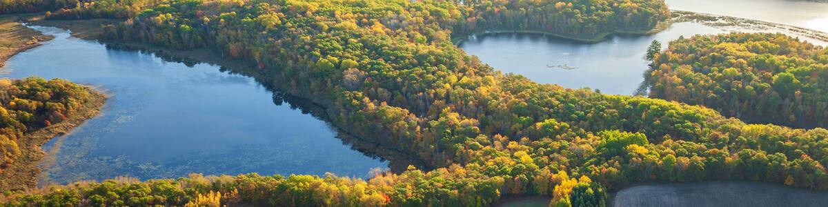 Aerial view of the Mississippi River and farm fields in northern Minnesota on a bright autumn morning