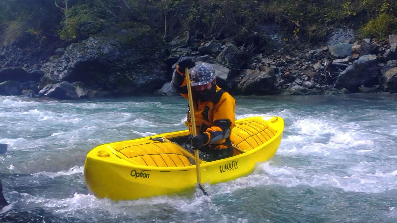 WW Open Canoeing - Paddler on the Inn River, "Giarsun" Section, WW III-IV; paddling an 2013 model of Open Canoe, the "Option" made by Blackfly Canoes out of Polyethylene, a boat suitable for steep creeking and river running.