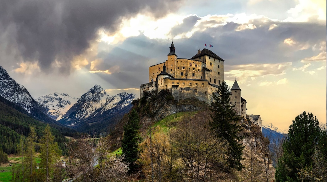 Impressive mountain scenery with amazing medieval castle Tarasp surrounded by Swiss Alps, Canton Grisons or Graubuendon, Switzerland