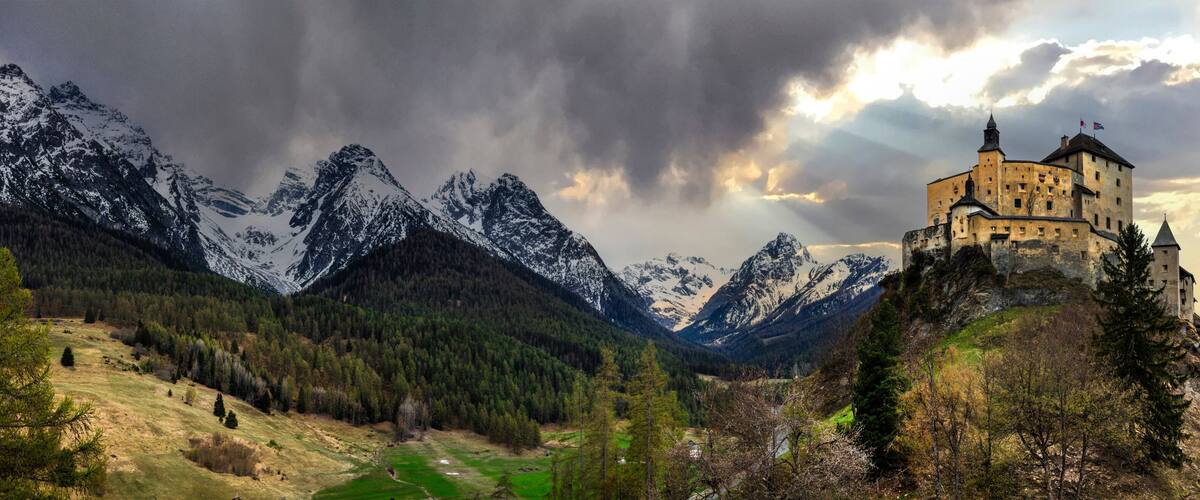 Impressive mountain scenery with amazing medieval castle Tarasp surrounded by Swiss Alps, Canton Grisons or Graubuendon, Switzerland
