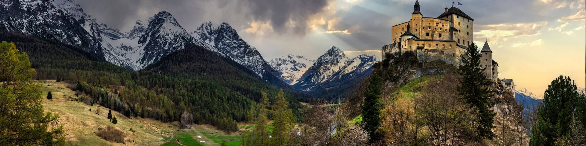 Impressive mountain scenery with amazing medieval castle Tarasp surrounded by Swiss Alps, Canton Grisons or Graubuendon, Switzerland