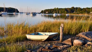 A fisherman's dinghy tied up at the shore in early autumn. Setauket Harbor, Long Island.