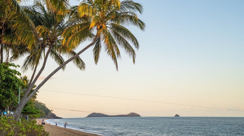 Trinity Beach featuring a sunset, a sandy beach and general coastal views