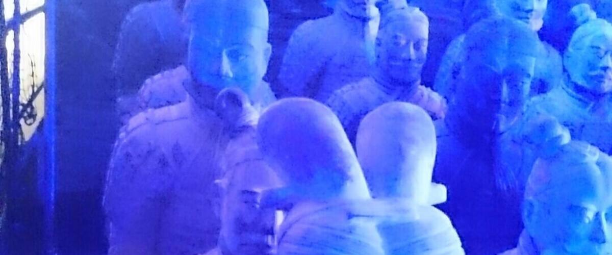 Terracotta Army Exhibition with life size replicas of the army highlighted with #blue light