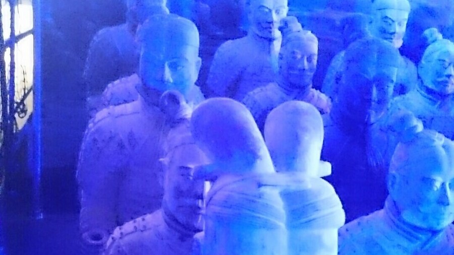 Terracotta Army Exhibition with life size replicas of the army highlighted with #blue light