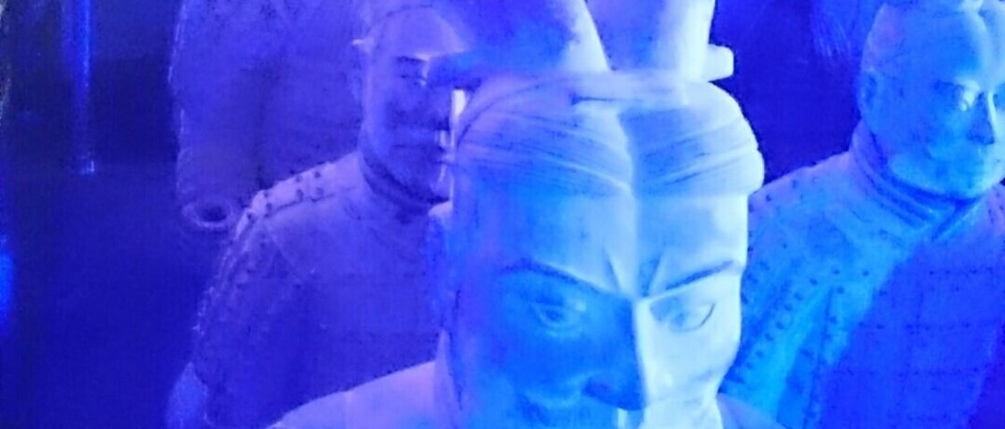 Terracotta Army Exhibition with life size replicas of the army highlighted with #blue light
