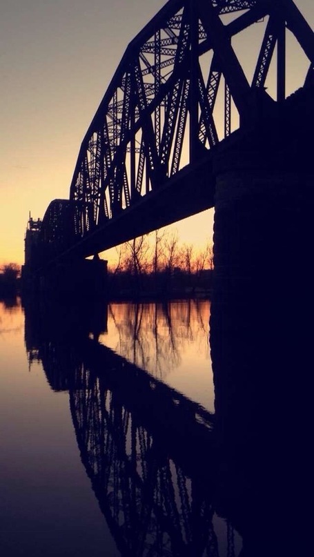 Train bridge behind the chicken plant. It's especially beautiful during sunset.