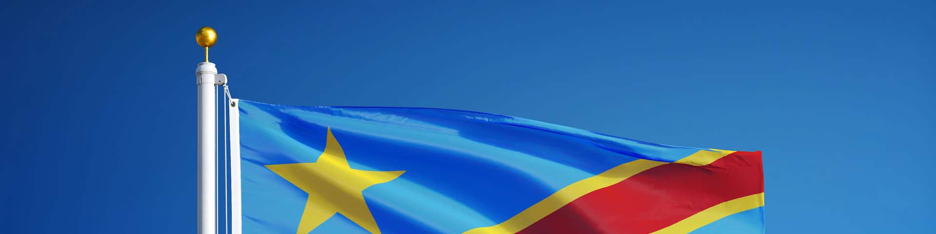 Democratic Republic of the Congo flag waving against clean sky, close up, isolated with clipping path mask alpha channel transparency, for film, news, digital composition