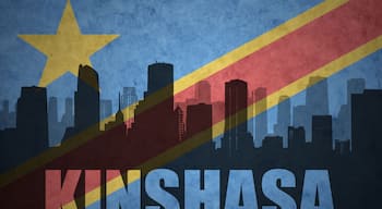 abstract silhouette of the city with text Kinshasa at the vintage democratic republic of the congo flag
