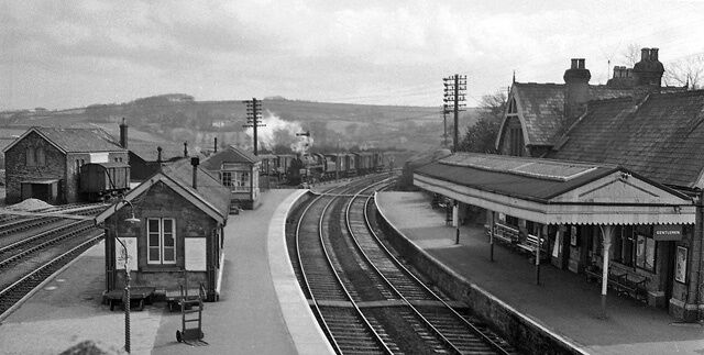 Bere Alston Station. View eastwards, towards Okehampton, Exeter and , eventually, London Waterloo; ex-London & South Western main line Exeter - Okehampton - Plymouth, and Plymouth, Devonport & South Western Junction branch to Gunnislake and Callington. The main line from Okehampton was closed 6/5/68, leaving a service Plymouth (North Road) - Callington (reversing at Bere Alston), which had been cut back to a (rebuilt) Gunnislake station from 7/11/66. (Plymouth Friary had closed 15/9/58, passenger services thereafter starting at North Road).