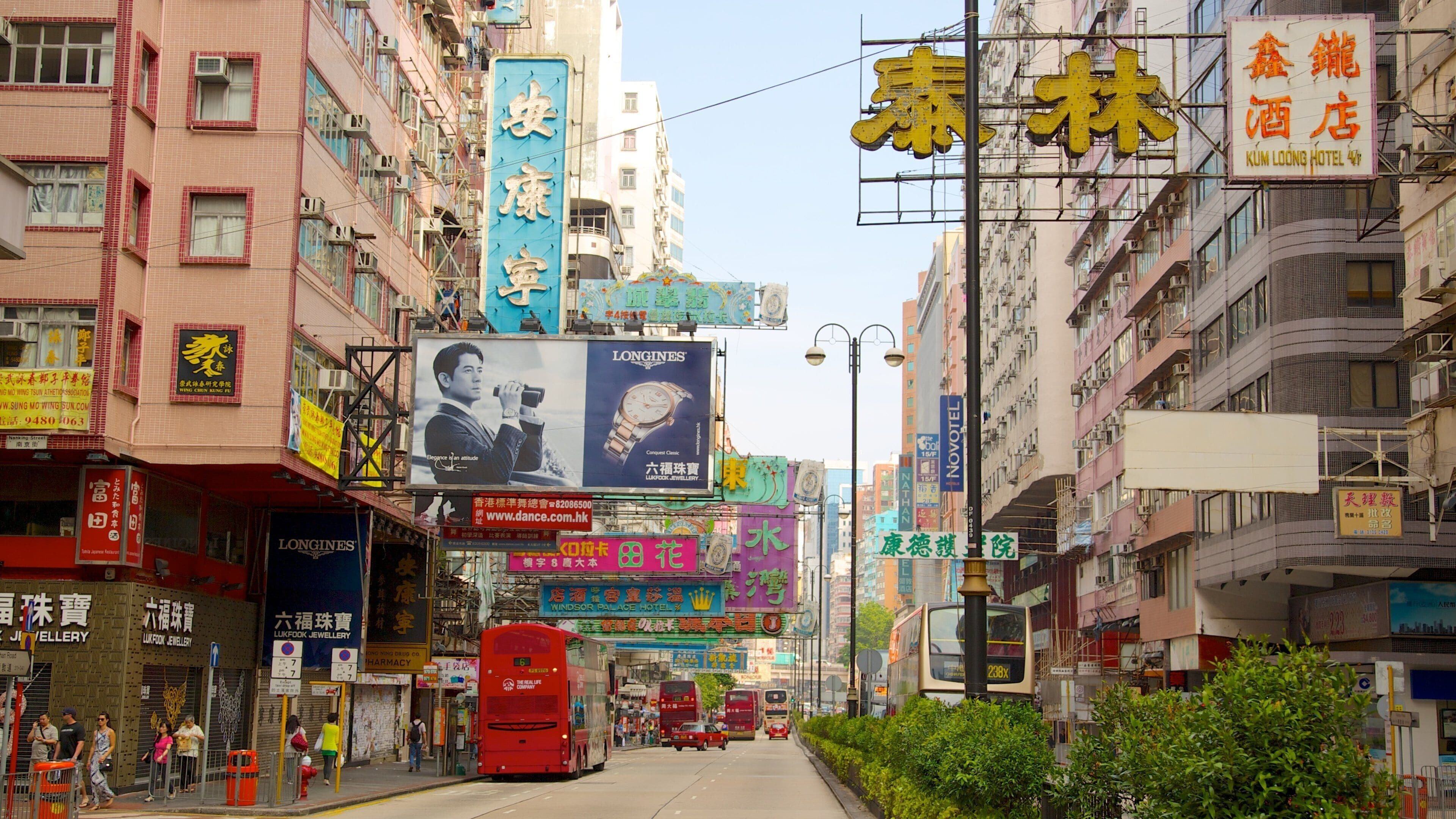 Tsim Sha Tsui showing signage, a city and street scenes