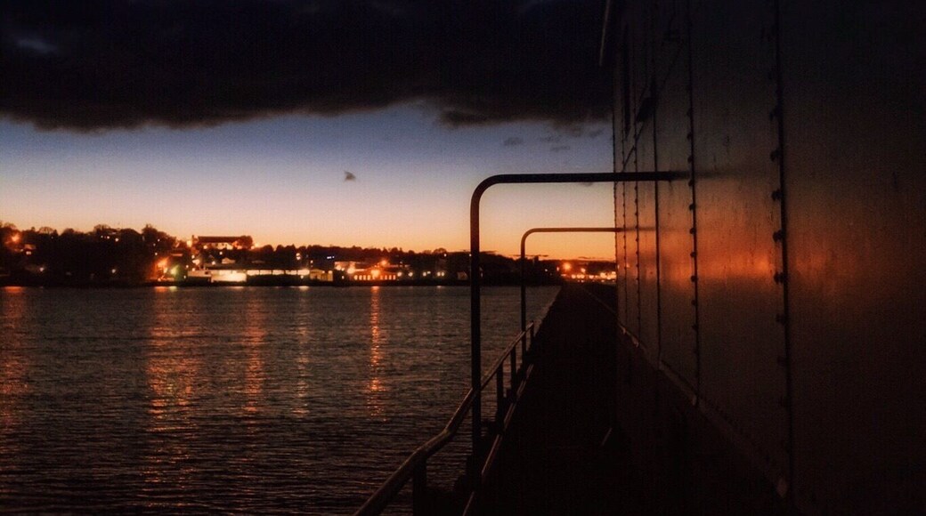 You can walk around the lighthouse at the end of the pier. When walking around and seeing Kewanee on the other side I really liked the last bit of light reflecting off of the lighthouse.
The Kewaunee Lighthouse represents the maritime heritage of the harbor while continuing to serve as a navigational beacon to Lake Michigan boating traffic. The property's period of historic significance begins in 1931 when it was established as a lighthouse and ends in 1959, the most recent year of its operation 50 years before the present.
The lighthouse personifies early twentieth century lighthouse architecture and engineering. It exemplifies design and construction methods used in building lighthouses and fog signal buildings on piers during that time period. This structure possesses its original location, setting and design, and embodies historical qualities of integrity in materials, workmanship, feeling and association. The lighthouse lantern room houses a historic fifth order Fresnel lens with an electric light that is currently used by the USCG as a navigational aid. The character and appearance of Kewaunee Pierhead light are largely unchanged from when it was established as an aid to navigation.