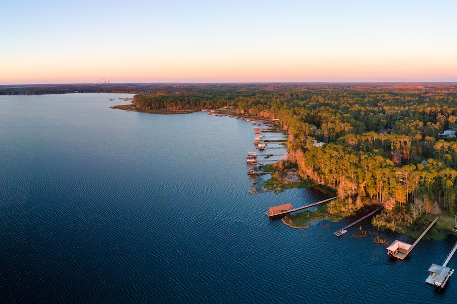 Panoramic aerial photograph of Lake Mary Jane, Orlando Florida. In the distance is the Stanton energy center.