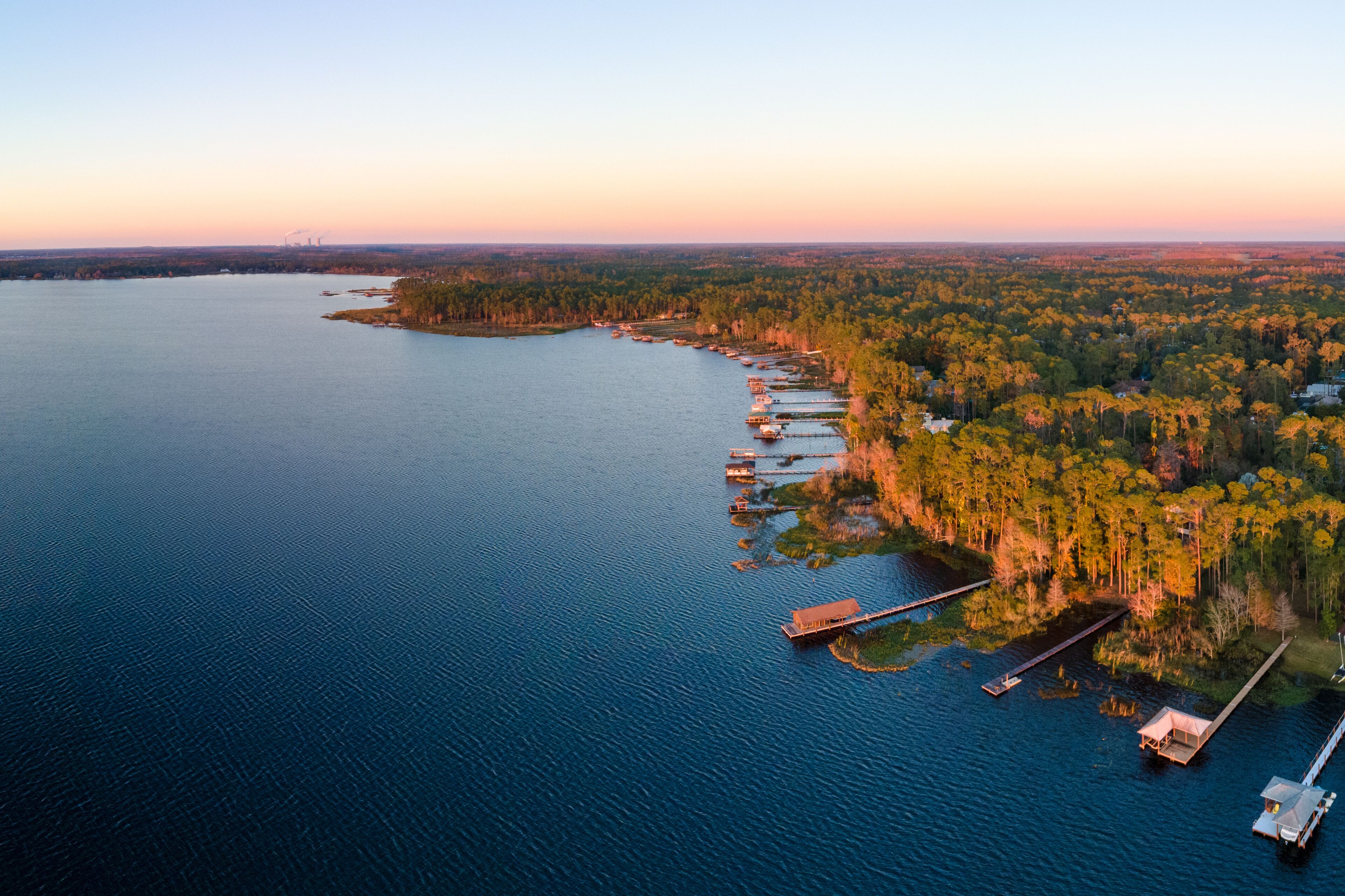 Panoramic aerial photograph of Lake Mary Jane, Orlando Florida.  In the  distance is the Stanton energy center.
