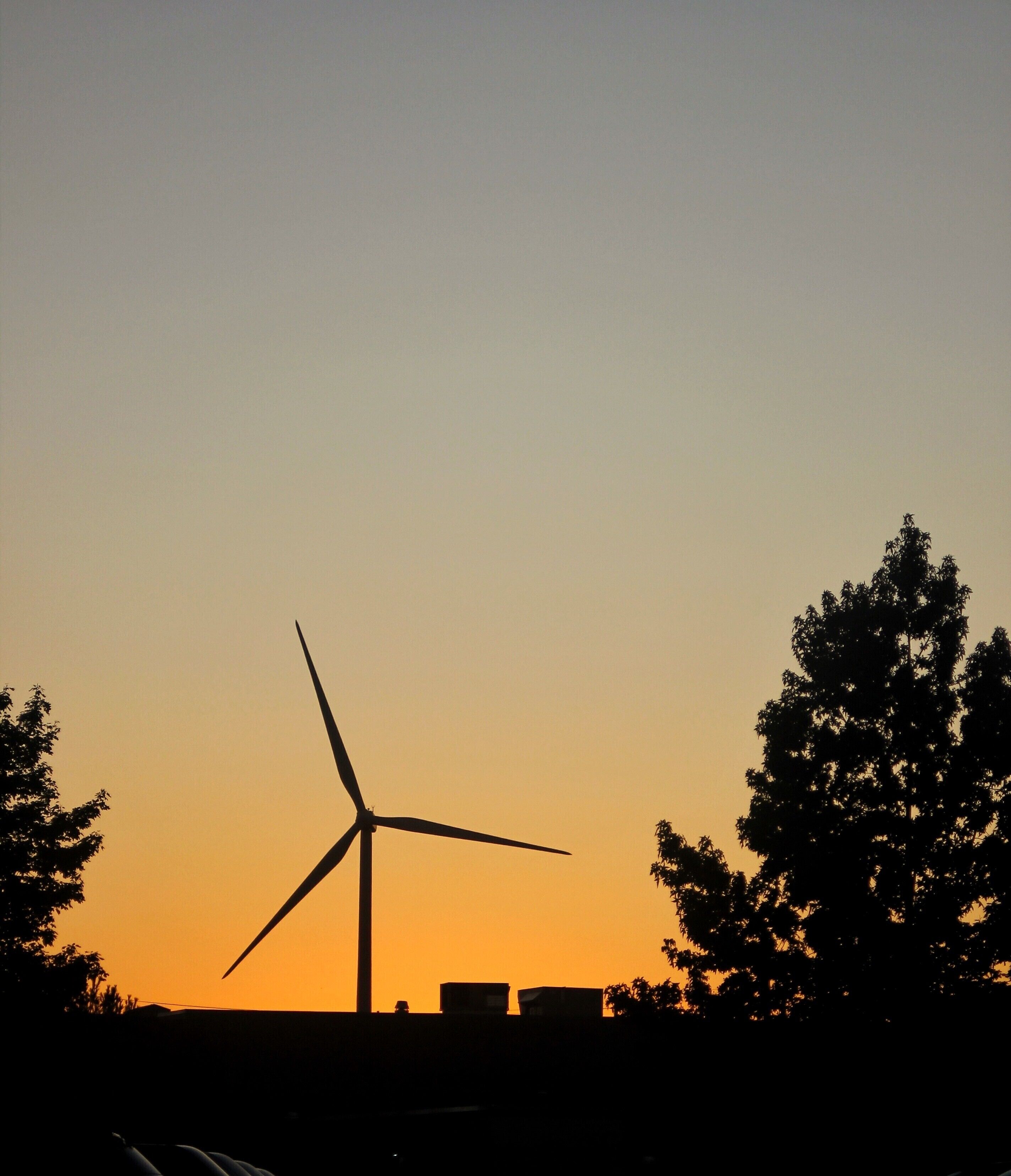 Wind turbine at sunset frozen in time