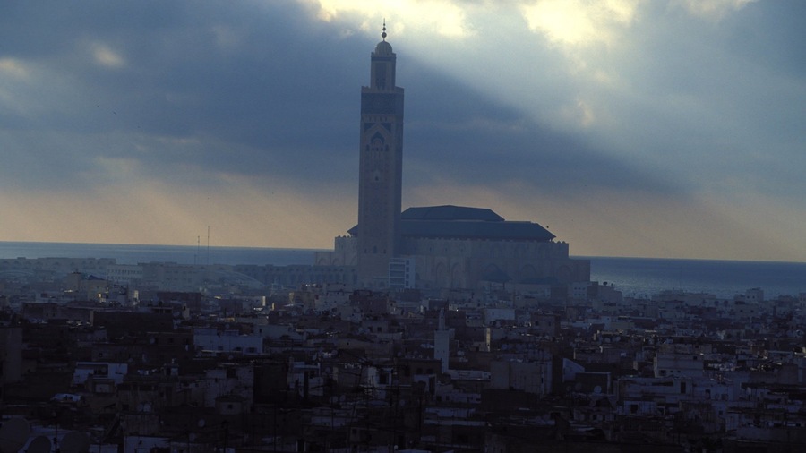 Morocco featuring a sunset, a church or cathedral and a city
