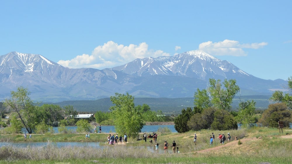 The Spanish Peaks are a pair of prominent mountains located in southwestern Huerfano County, Colorado. The Spanish Peaks were designated a National Natural Landmark in 1976.