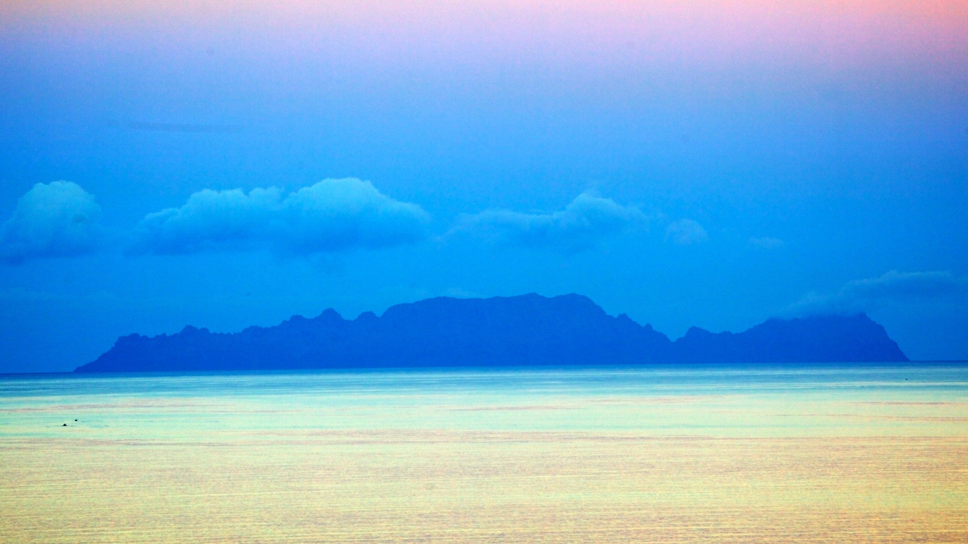 Funchal featuring general coastal views, island images and a sunset