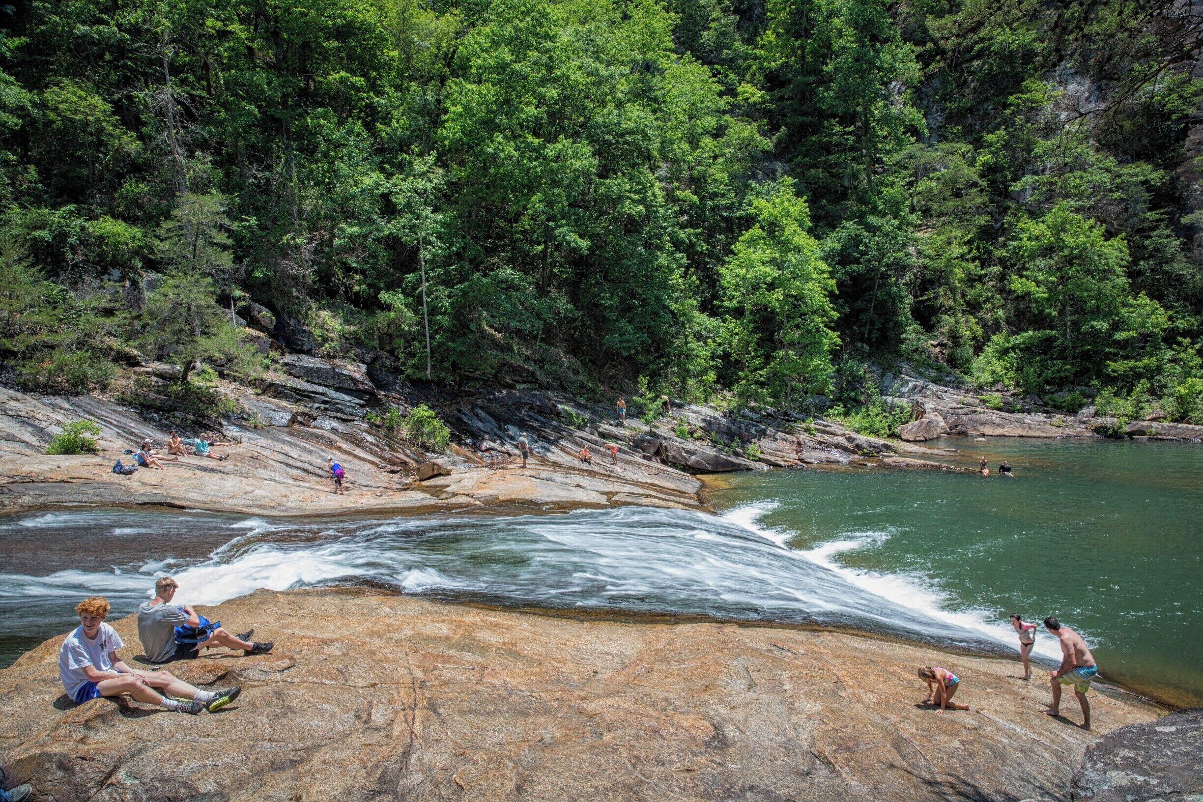 This is Bridal Veil Falls on the Tallulah River at the bottom of Tallulah Gorge on a hot June day.  Even though it's a steep climb down into the gorge, many young kids and teenagers love to come here to slide down Bridal Veil Falls into the pool below.  The problem - the quarter mile climb out is extremely steep and more like a rock climb than a hike. 