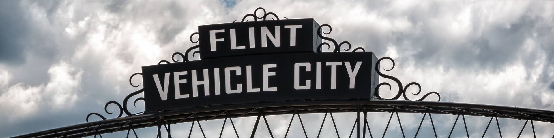 Flint, Michigan downtown gateway sign showing Vehicle City. Known widely for their water quality and safety issues.