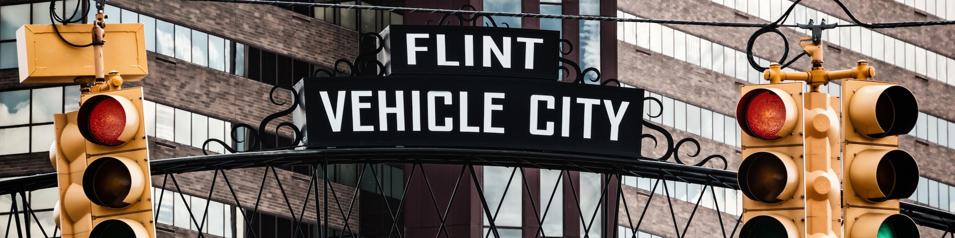 Flint, Michigan downtown gateway sign showing Vehicle City. Known widely for their water quality and safety issues.
