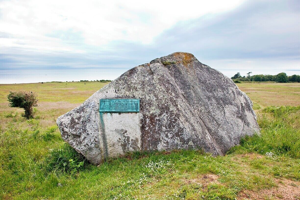 This large glacial erratic sits near the redoubt at American Camp.  It was left here by a receding glacier more than 10,000 years ago, and now bears a Daughters of the American Revolution plaque dedicated to Lt Henry Robert.  In 1859 Robert was in the US Army Corps of Engineers when he designed and supervised the construction of a redoubt (earthwork) to protect American Camp from British warships.  Both countries lay claim to San Juan Island at the time, and tensions ran high after a Hudson’s Bay Company pig was killed by an American farmer.  You can read more about the Pig War here:

http://www.nps.gov/sajh/historyculture/upload/2012-American_Camp_History_Walk_online_color.pdf