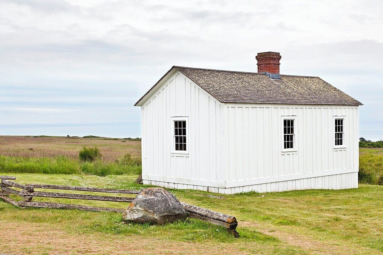 Here we have the laundress' quarters, where as many as three laundresses and their families lived from 1860 to 1872.  Each laundress washed the clothes of around 20 soldiers and earned about $20/month.  She also had to be married, and if she lost her husband she had 60 days to find another or would be discharged from the camp.

The building itself isn't all that interesting, other than that is has survived for 150 years.  After the camp was closed the house was purchased by Edward Warbass and moved to Friday Harbor where it survived as a private residence until 1972, at which time the Park Service purchased it, moved it back to it's original location, and restored it.