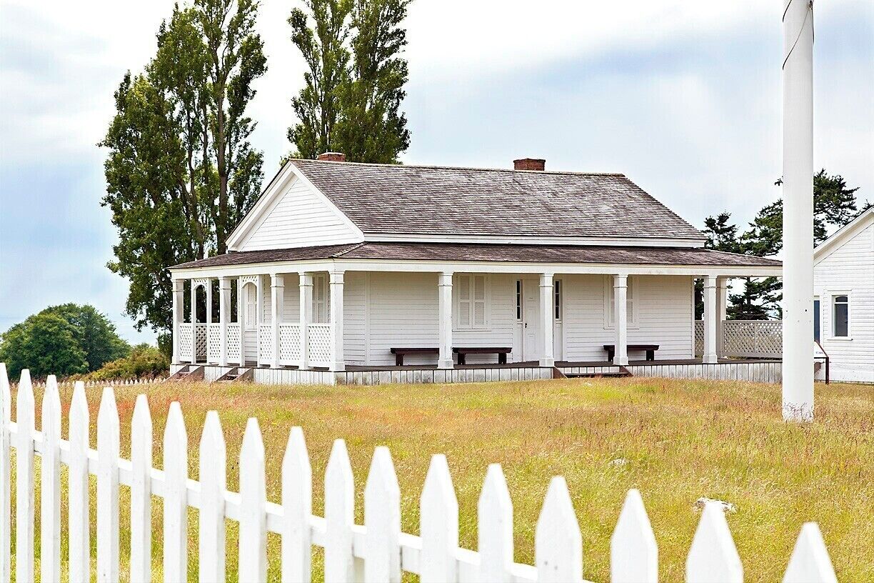 Only three buildings remain from the military camp that was located here for 14 years starting in 1859.  Generally speaking, the buildings weren't built to last, so it's impressive that these have survived for more than 150 years.

The building pictured here was one of the officers' quarters.  It was likely moved from Fort Bellingham in 1859 and occupied by Capt. George Pickett (of later Gettysburg fame).  After the camp was disbanded in 1874 the building was auctioned off and converted into a farmhouse.  It was later acquired by the National Park Service and restored to original condition.  

The building next to it was the other officers' quarters.  After the auction it was moved to downtown Friday Harbor and employed for over 130 years.  In 2010 it too was acquired by the National Park Service, which moved it back to it's historic location.

You can read more about American Camp here:  http://www.nps.gov/sajh/historyculture/upload/2012-American_Camp_History_Walk_online_color.pdf