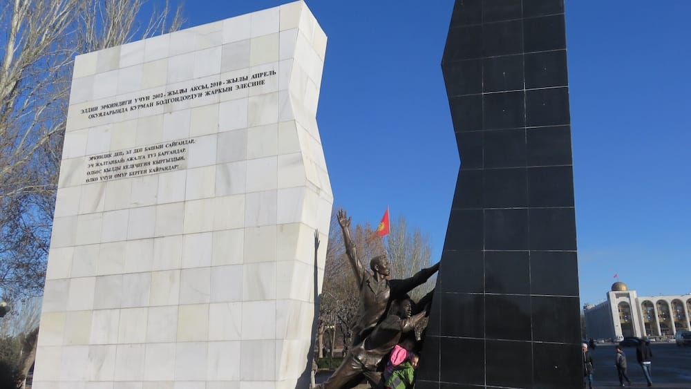 The kids were helping to push apart this monument. I had to do a little fact finding. The new monument commemorates the "April Revolution" where the black represents the Bakiyev era.