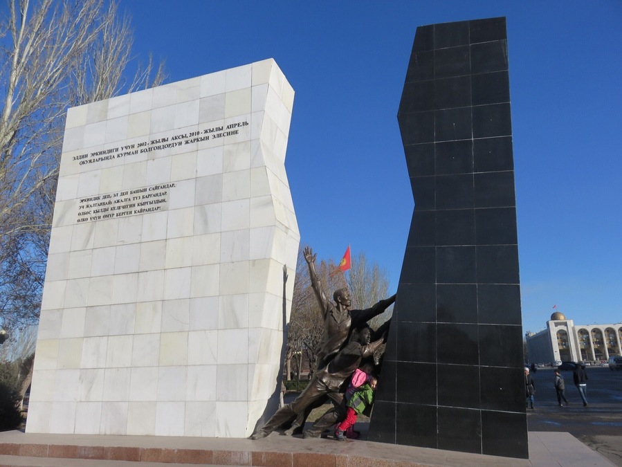 The kids were helping to push apart this monument. I had to do a little fact finding. The new monument commemorates the "April Revolution" where the black represents the Bakiyev era.