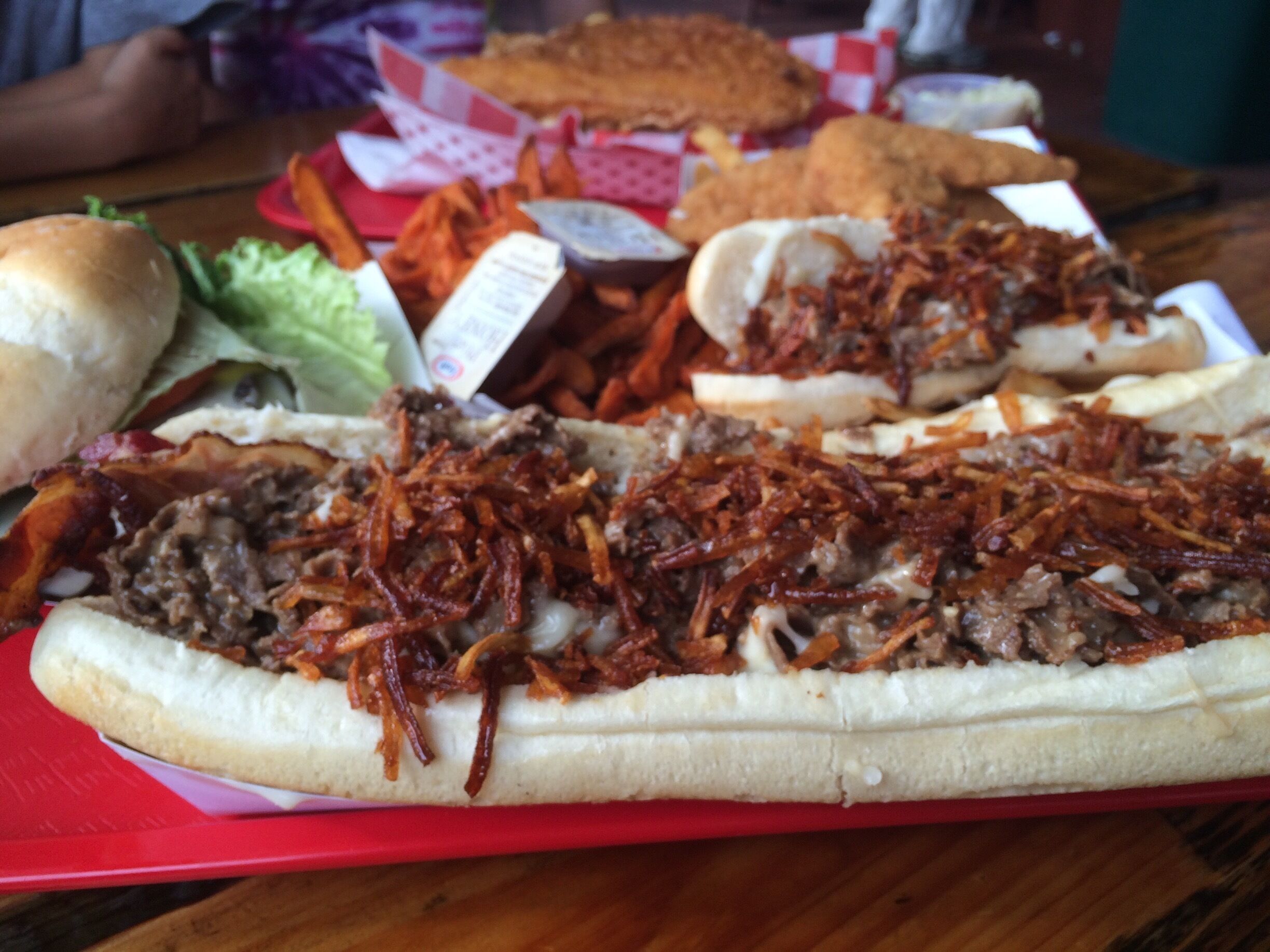 Once taken on by the Man vs Food show the original haystack is a delicious but monstrous steak sandwich with a half pound of seasoned steak, melted mozza cheese and crispy shoestring potatoes in a hoagie roll. #foodiefinds 