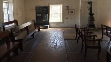 The white line on the floor marks the room where Billy the Kid was chained to the floor awaiting his hanging date. He escaped and shot and killed two deputies during his escape. The room was removed during renovations to turn "The House" into a courthouse.