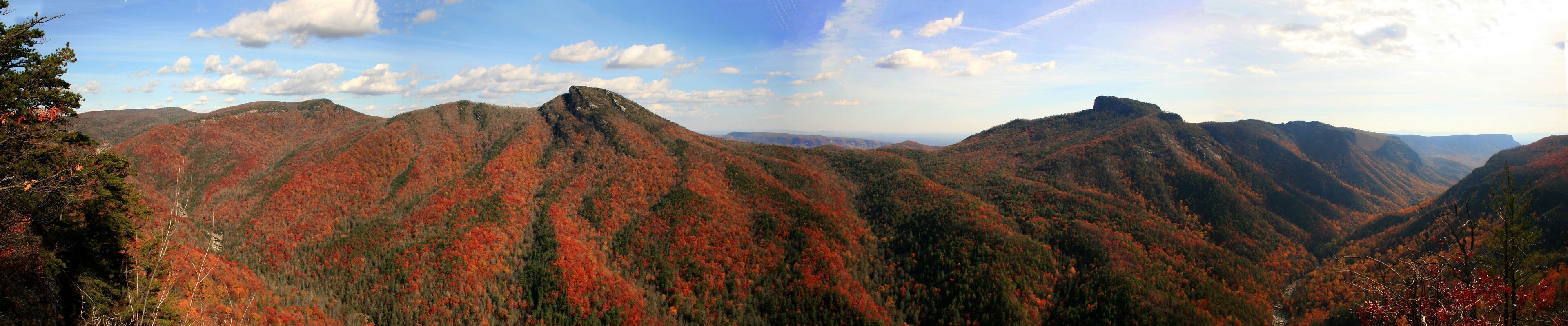 A mountainous landscape with autumn foliage.