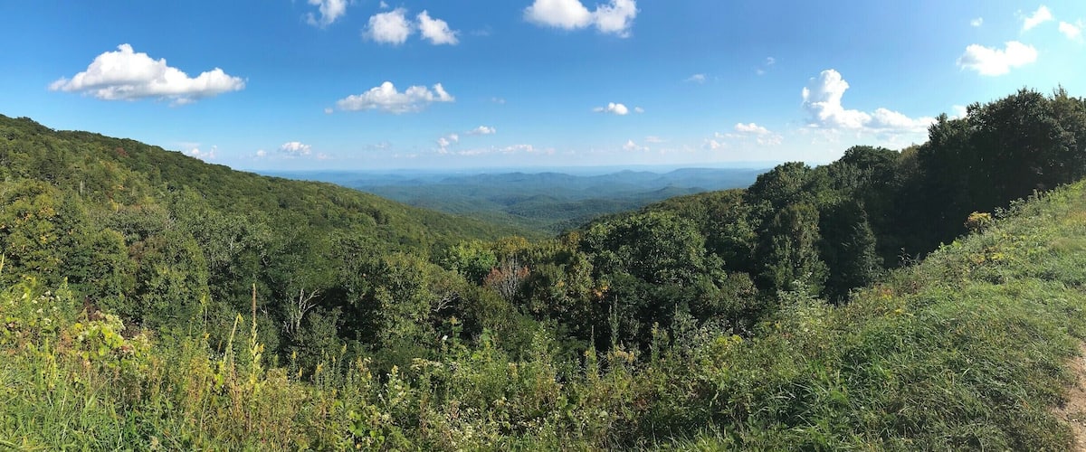 This photo was taken on September 20th, around 4:30 pm.  This overlook on the Blue Ridge Parkway really shows how a moment of peace and quiet is only but a short drive from Boone, NC.  I like to visit this area while the weather is still warm and the Parkway is open for whomever wishes to visit.  The Blue Ridge Parkway, though likely not the quickest route to any destination, sure is worth the extra gas money.  While cruising through some of the most beautiful parts of North Carolina and Virginia, the plethora of breathtaking overlooks entice you to stop what you are doing and quite literally enjoy the view.  There is a calm that overtakes you when on the Blue Ridge.  What you are seeing in front of you makes you feel so small and distant from the rest of the world.  However, when you look to your side you see the handful of other spectators who are likely looking for tranquility.
#AppalachianEchoes