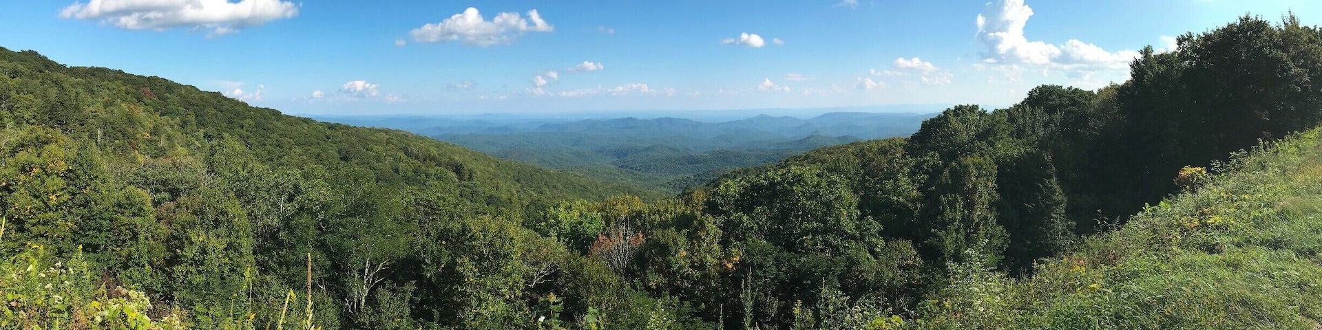 This photo was taken on September 20th, around 4:30 pm. This overlook on the Blue Ridge Parkway really shows how a moment of peace and quiet is only but a short drive from Boone, NC. I like to visit this area while the weather is still warm and the Parkway is open for whomever wishes to visit. The Blue Ridge Parkway, though likely not the quickest route to any destination, sure is worth the extra gas money. While cruising through some of the most beautiful parts of North Carolina and Virginia, the plethora of breathtaking overlooks entice you to stop what you are doing and quite literally enjoy the view. There is a calm that overtakes you when on the Blue Ridge. What you are seeing in front of you makes you feel so small and distant from the rest of the world. However, when you look to your side you see the handful of other spectators who are likely looking for tranquility.
#AppalachianEchoes