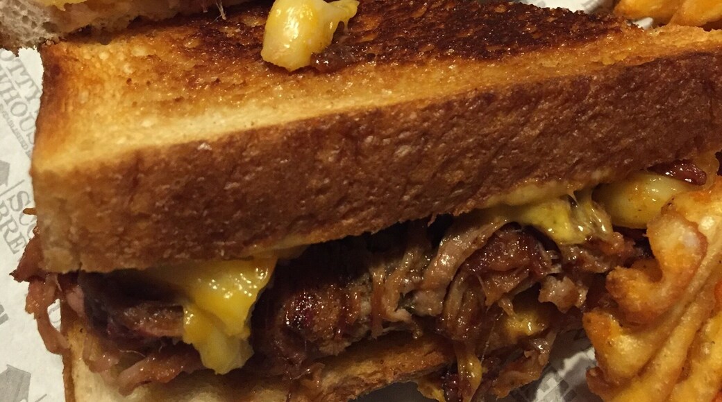 The "piggy mac grilled cheese" - cheddar and American cheeses, pulled pork, and Mac and cheese grilled cheese sandwich!