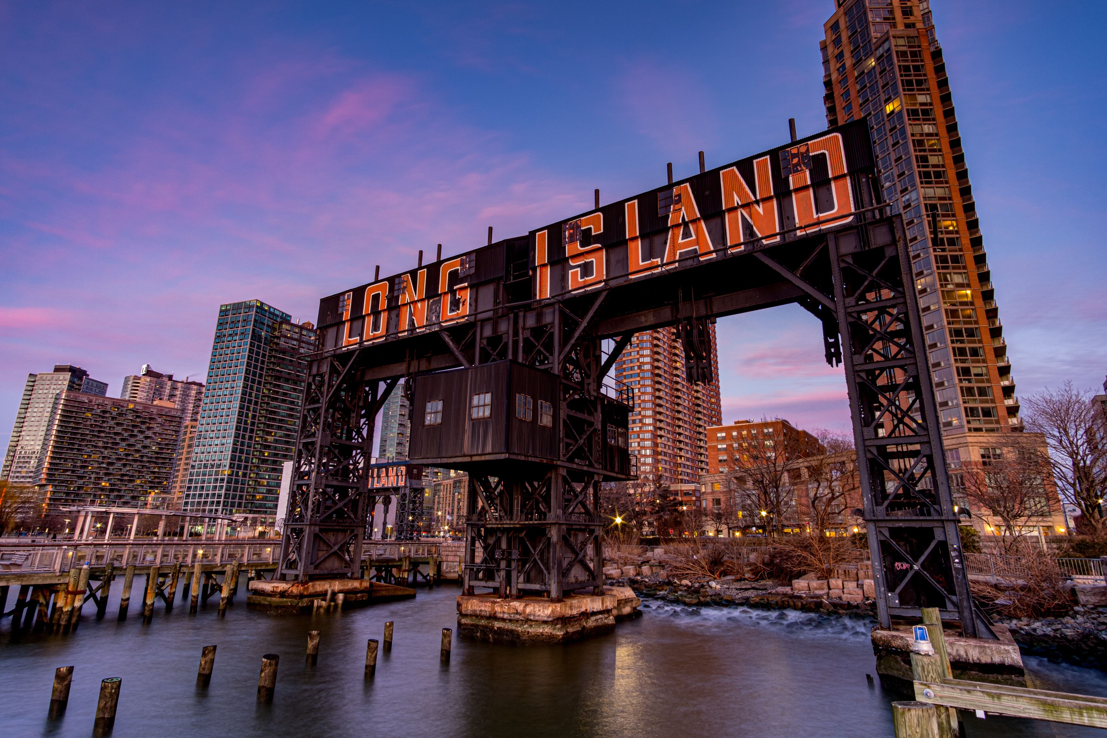 Sunset Pink Sky Over Long Island City Sign at Gantry Plaza State Park in Queens New York