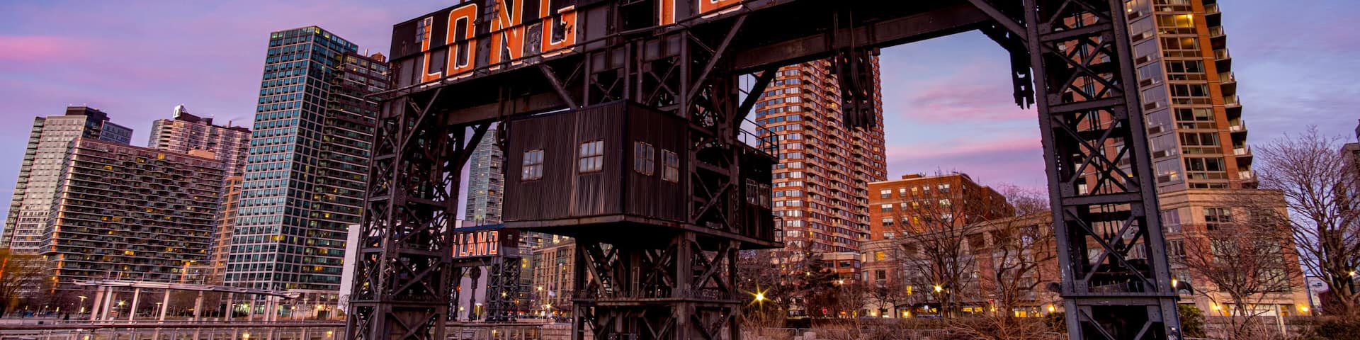 Sunset Pink Sky Over Long Island City Sign at Gantry Plaza State Park in Queens New York