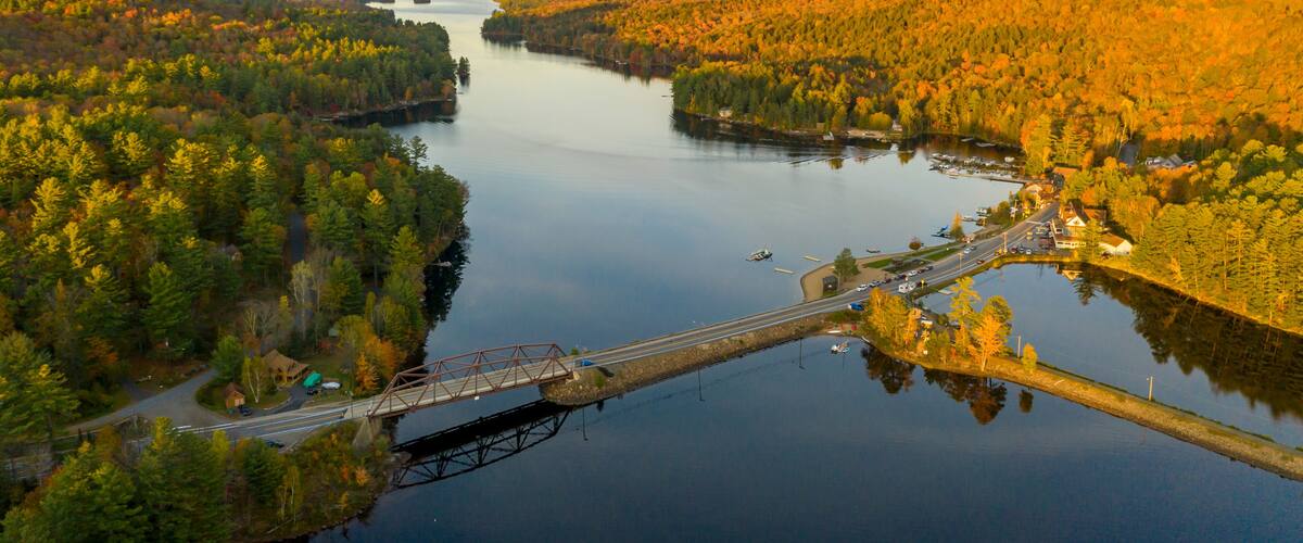 Sunset over Highway 30 Crossing Long Lake at Adirondacks Park Upstate NY