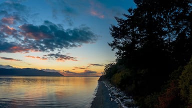 Sunset Over Orcas Island in the Salish Sea and the San Juan Island Archipelago. Beautiful and dramatic sunset with colorful clouds and a calm sea in the Pacific Northwest.