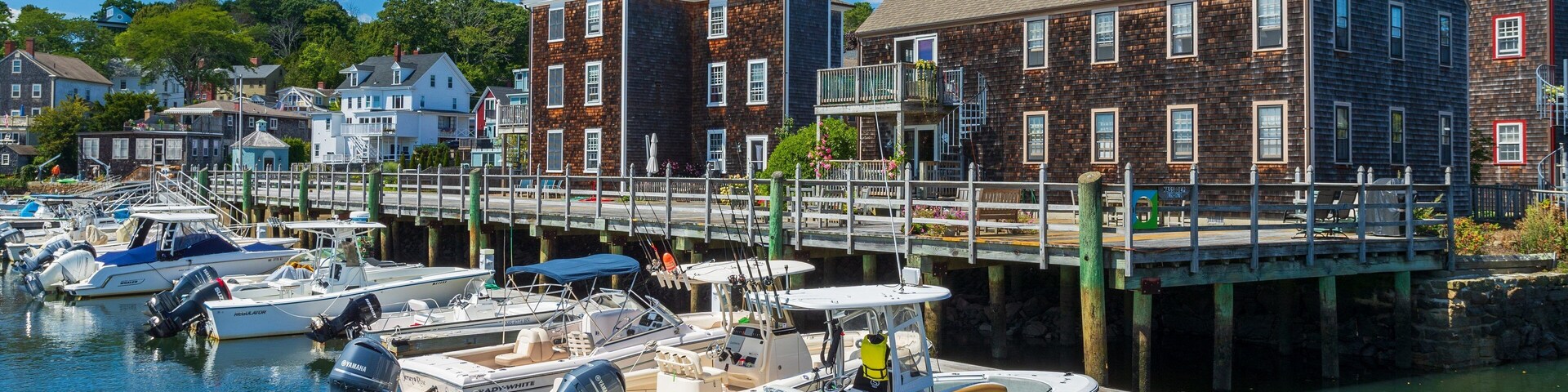 Manchester-by-the-Sea showing a coastal town and a bay or harbor