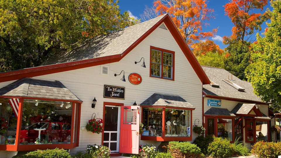A white building with red trim and a sign that reads "The Hidden Jewel."