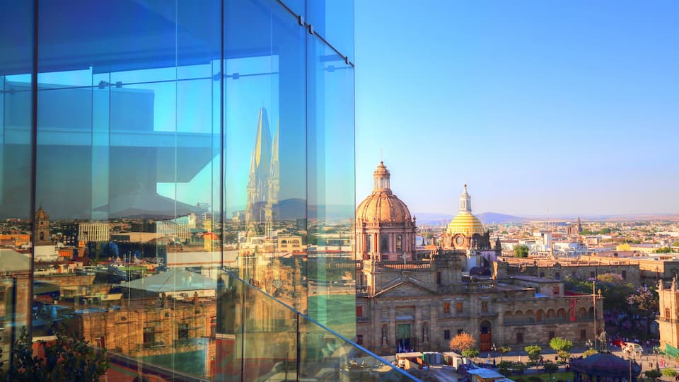 A cityscape with a prominent dome and a tall spire.